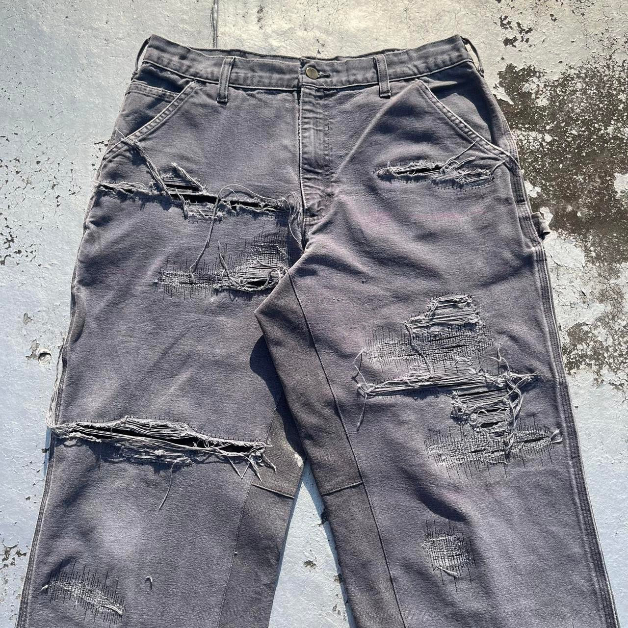 Distressed repaired carpenter pants