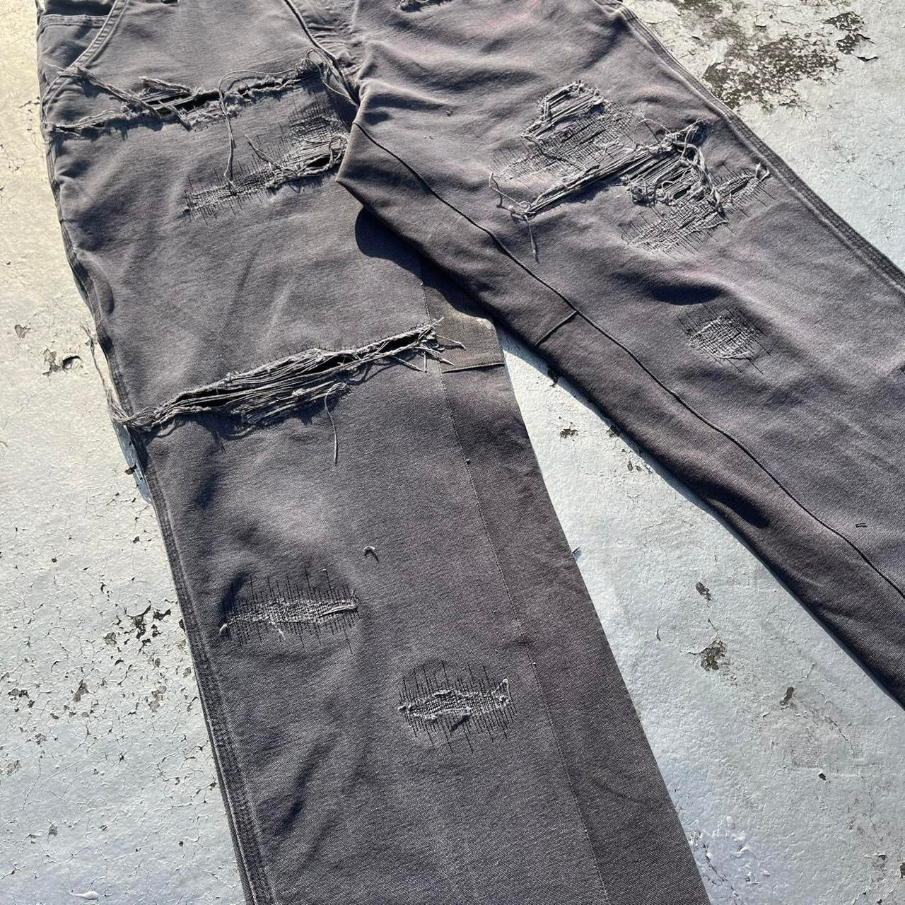 Distressed repaired carpenter pants