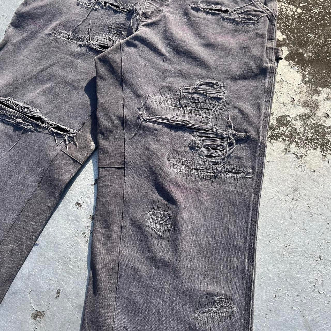 Distressed repaired carpenter pants