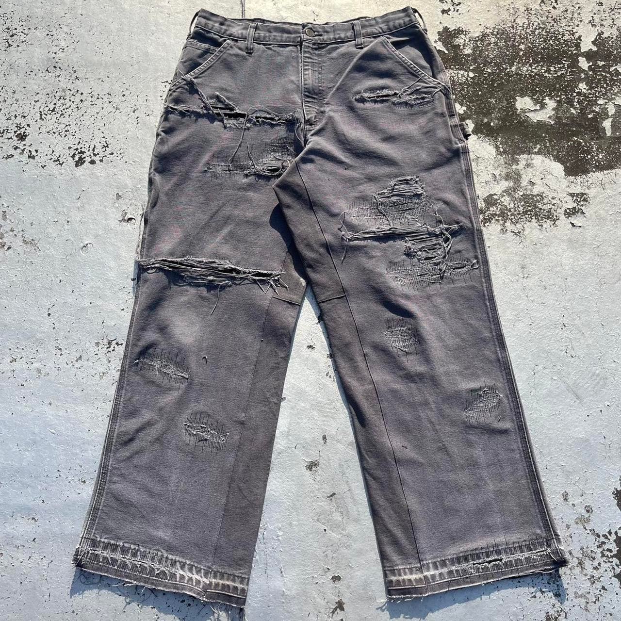 Distressed repaired carpenter pants