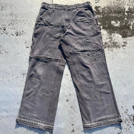 Distressed repaired carpenter pants