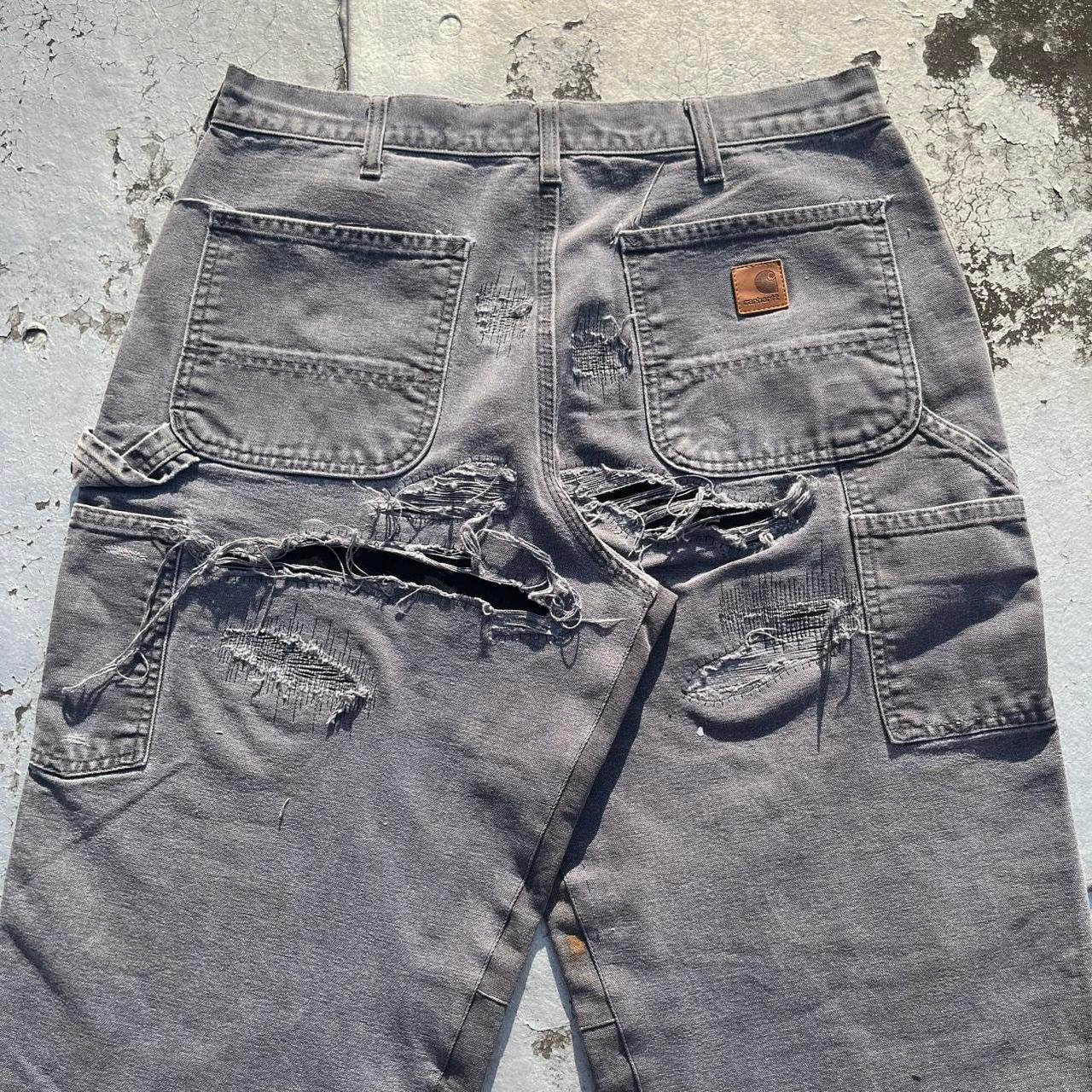 Distressed repaired carpenter pants